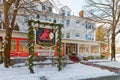 freshly fallen white snow on entrance to Red Lion Inn decorated for Christmas Royalty Free Stock Photo