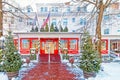 freshly fallen white snow on entrance to Red Lion Inn decorated for Christmas Royalty Free Stock Photo