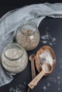 Freshly fermented rye and wheat starters in glass jars