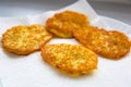 Freshly fried hash browns on a paper napkin