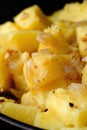 Freshly fried potatoes with onions in a pan Royalty Free Stock Photo