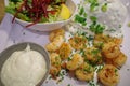 freshly fried shrimps are arranged on a plate with garlic sauce Royalty Free Stock Photo