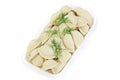 Freshly frozen semi-finished products. Dumplings with your, potatoes. The product is packed on plastic potdtons. Isolate on white