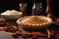 freshly grated nutmeg next to an unbaked pie