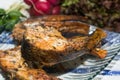 Freshly grilled fish on kitchen table. closeup, top view Royalty Free Stock Photo