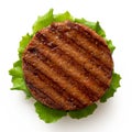 Freshly grilled plant based burger patty on bun with lettuce isolated on white. Top view Royalty Free Stock Photo