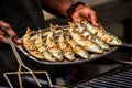 Freshly grilled sardines on silver plate Royalty Free Stock Photo