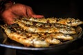 Freshly grilled sardines on silver plate Royalty Free Stock Photo
