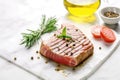 freshly grilled tuna steak on a white marble countertop Royalty Free Stock Photo