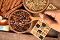 Freshly ground coffee beans in a metal filter and different coffee beans in a square box Royalty Free Stock Photo