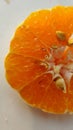 Freshly Half Cut Peeled-off, Juicy Orange Close-Up Macro with White background Royalty Free Stock Photo