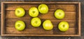 Freshly harvested green apples in the wooden crate. Selective focus Royalty Free Stock Photo