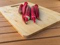 Freshly harvested okra on a cutting board