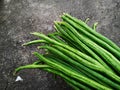 Freshly Harvested Long Beans Arranged in a Bundle on a Rough Gray Concrete or Stone Surface Royalty Free Stock Photo