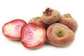 Freshly harvested red chioggia beet root and two halves