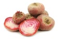 Freshly harvested red chioggia beet root and two halves