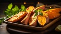 Freshly harvested sweet potato with vibrant orange flesh on a rustic wooden background Royalty Free Stock Photo