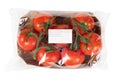 Freshly harvested tomatoes packaged and labeled on isolated white background