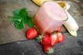 Freshly and healthy beverage (drink), banana - strawberry smoothie in glass Royalty Free Stock Photo