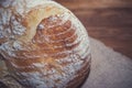 Freshly home baked bread on wooden background