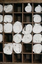 Freshly laundered fluffy towel rolls on a wooden commode. Welcome resort decor in slow motion.