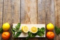 Freshly lemons and oranges on wooden boards