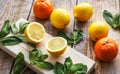 Freshly lemons and oranges on wooden boards