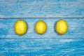 Freshly lemons on rustic blue board background