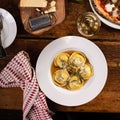 Freshly made brown butter cheese ravioli with sage