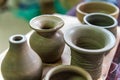 Freshly made clay vases in pottery workshop