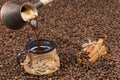 Freshly made coffee is poured from the coffee pot into the cup. Royalty Free Stock Photo