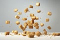 Freshly made crispy croutons fall in pile on gray background. Creative concept of floating healthy snacks.