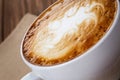 Freshly made cup of cappuccino with abstract latte art Royalty Free Stock Photo