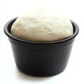 Freshly made dough rises in a black bowl Royalty Free Stock Photo