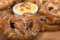 Freshly made German style pretzel with a cheddar cheese spread Royalty Free Stock Photo