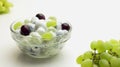 Freshly made grape salad with sour cream dressing in a glass bowl