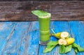 Freshly Made Healthy Green Smoothie from Banana, Spinach, a blue Rustic Background, Copy space Royalty Free Stock Photo