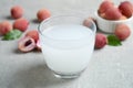 Freshly made lychee juice on light table, closeup
