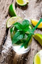 Freshly made mojito with mint and lime, sugar and rum. On a wooden table. Royalty Free Stock Photo