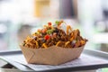 Freshly made nachos salsa on a tray in a paper plate at a street cafe Royalty Free Stock Photo