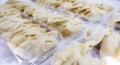 Uncooked Raw Chinese Style Dumpling with Flour Royalty Free Stock Photo
