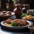 Freshly made Syrian Kibbeh with traditional ceramic plates and salad