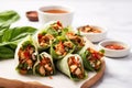 freshly made turkey lettuce wraps on a marble countertop