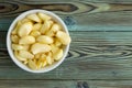 Freshly peeled aromatic garlic cloves in a ramekin