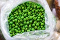 Freshly peeled green peas placed in a plastic bag for sale at a local vegetable market