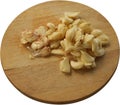 Freshly Peeled and Smashed Garlic on Round Cutting Board - Isolated Royalty Free Stock Photo