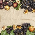 Freshly picked autumn fruits. Black grapes and figs on dark table wooden table Royalty Free Stock Photo