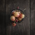 Freshly picked cherries on dark wooden table Royalty Free Stock Photo