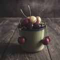 Freshly picked cherries on dark wooden table Royalty Free Stock Photo
