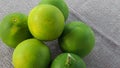 Freshly picked green sour oranges